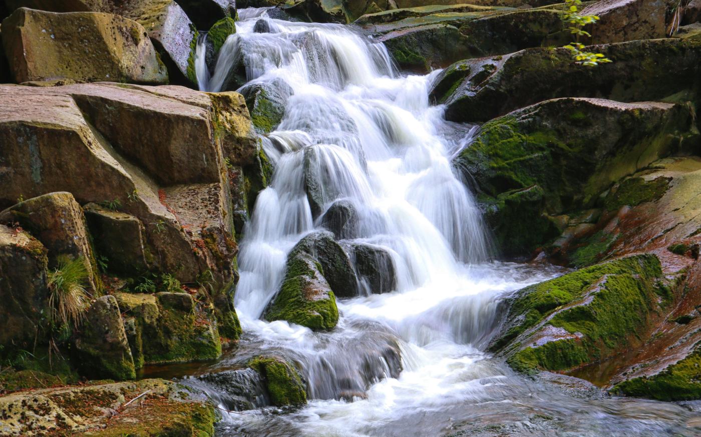 time lapse photo of waterfalls by Alexander Hipp courtesy of Unsplash.