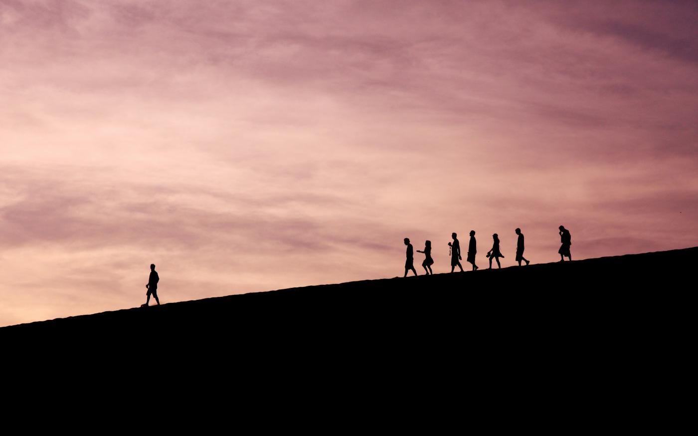 silhouette of people on hill by Jehyun Sung courtesy of Unsplash.