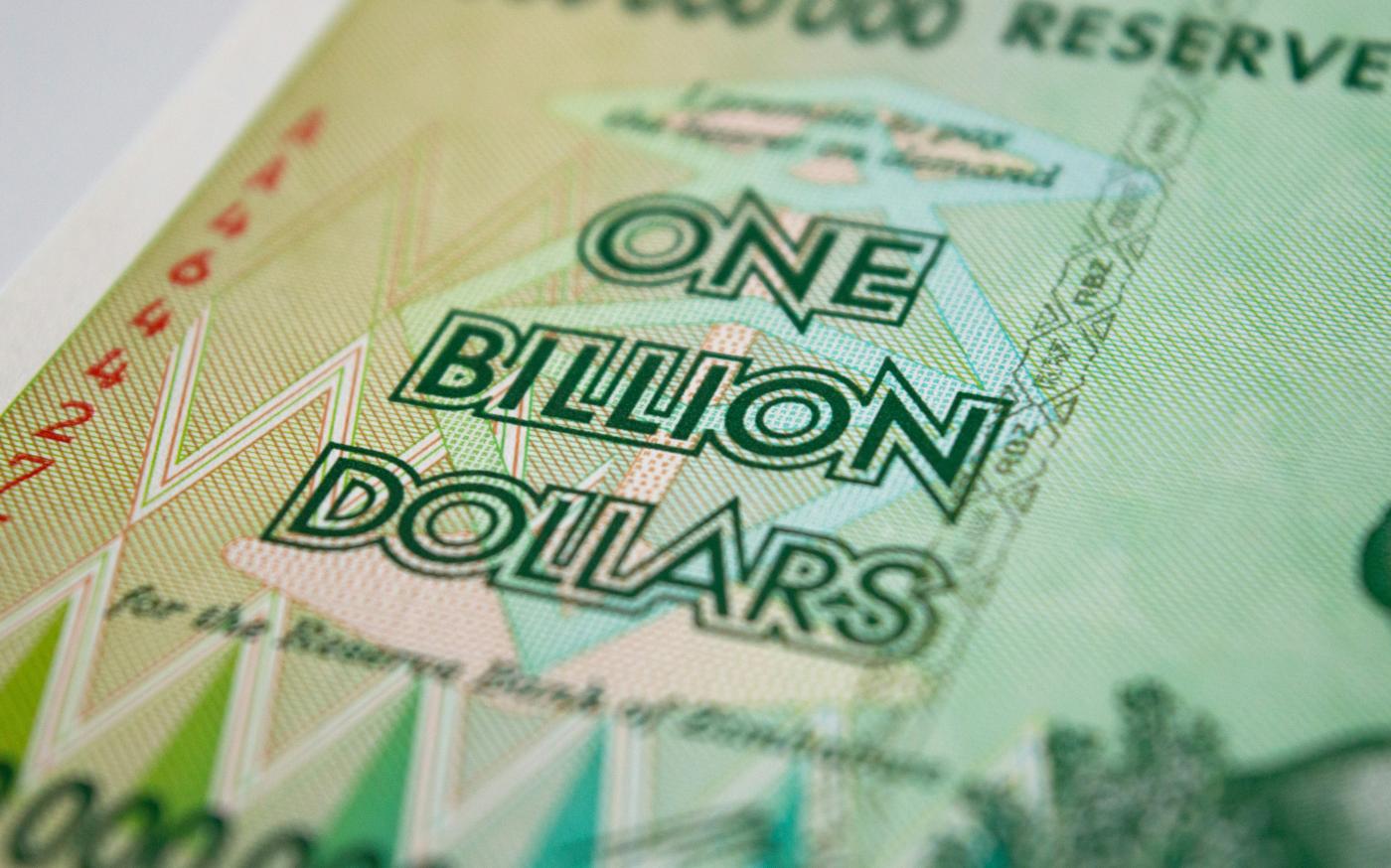a one billion dollar bill with the words one billion dollars printed on it by Rob courtesy of Unsplash.