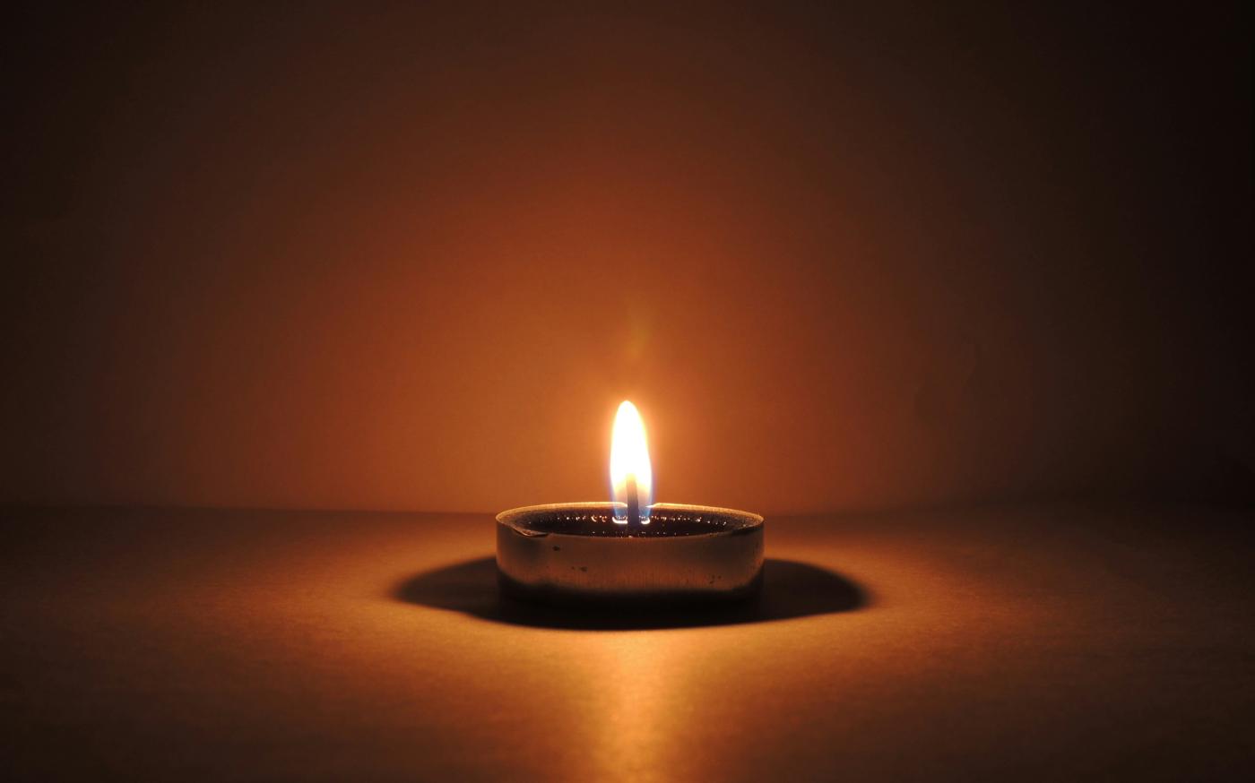 round ceramic bowl with lighted candle by CHIRAG K courtesy of Unsplash.