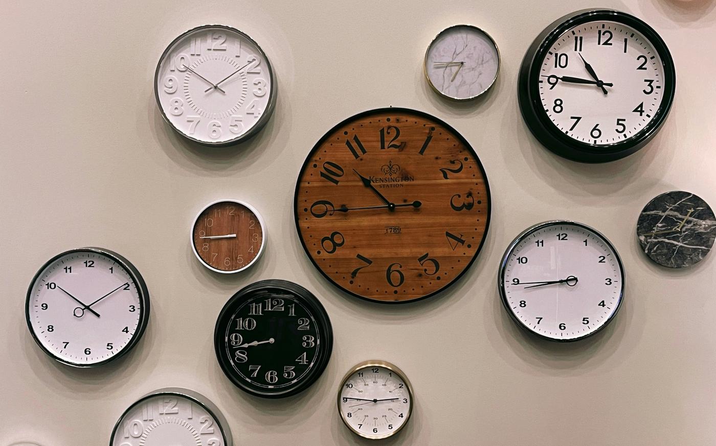 white and brown analog wall clock at 10 00 by Jon Tyson courtesy of Unsplash.