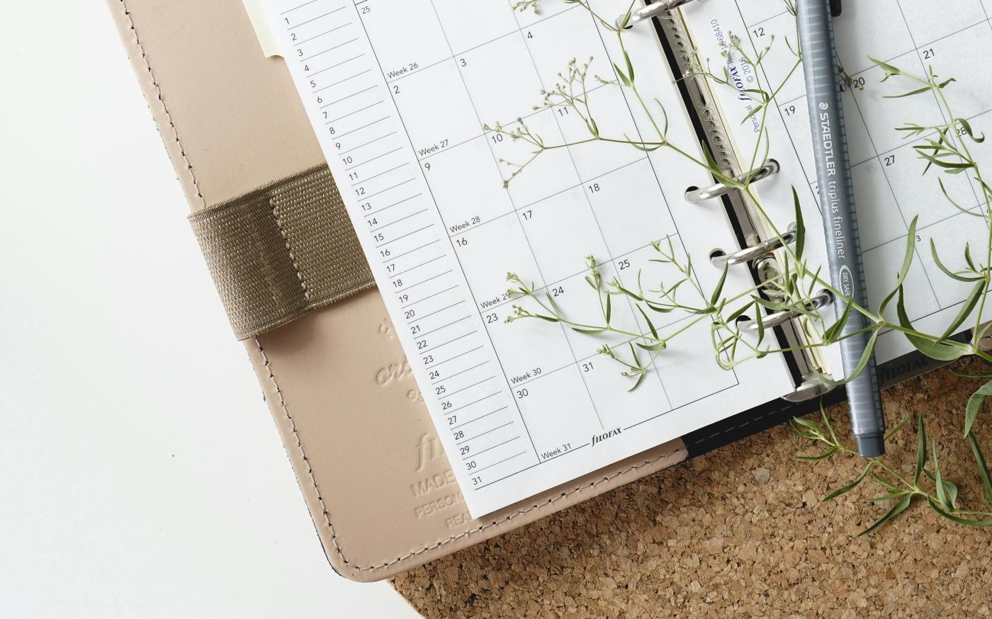 grey and black pen on calendar book by Renáta-Adrienn courtesy of Unsplash.