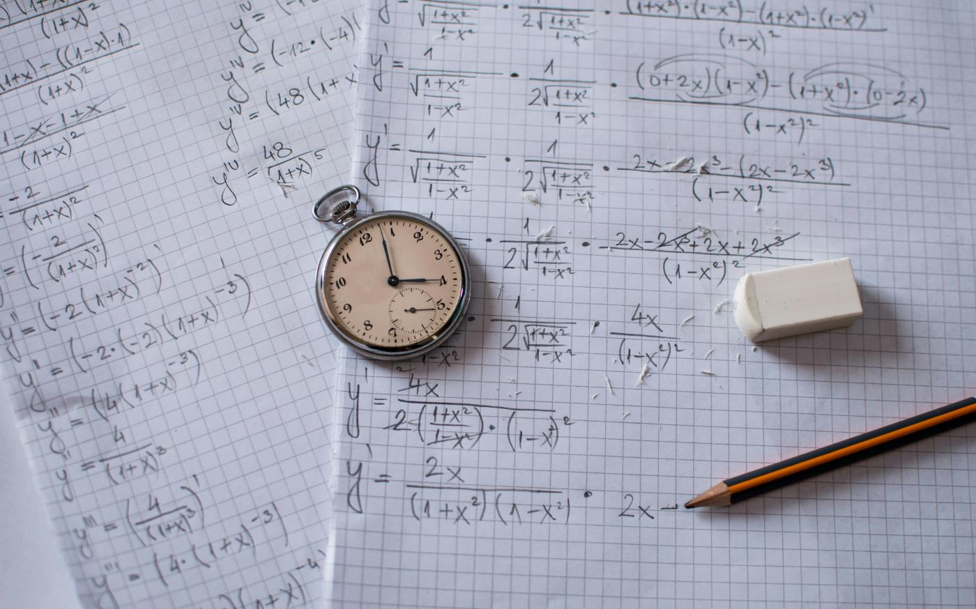 silver and white round analog watch beside white printer paper by Luka Savcic courtesy of Unsplash.