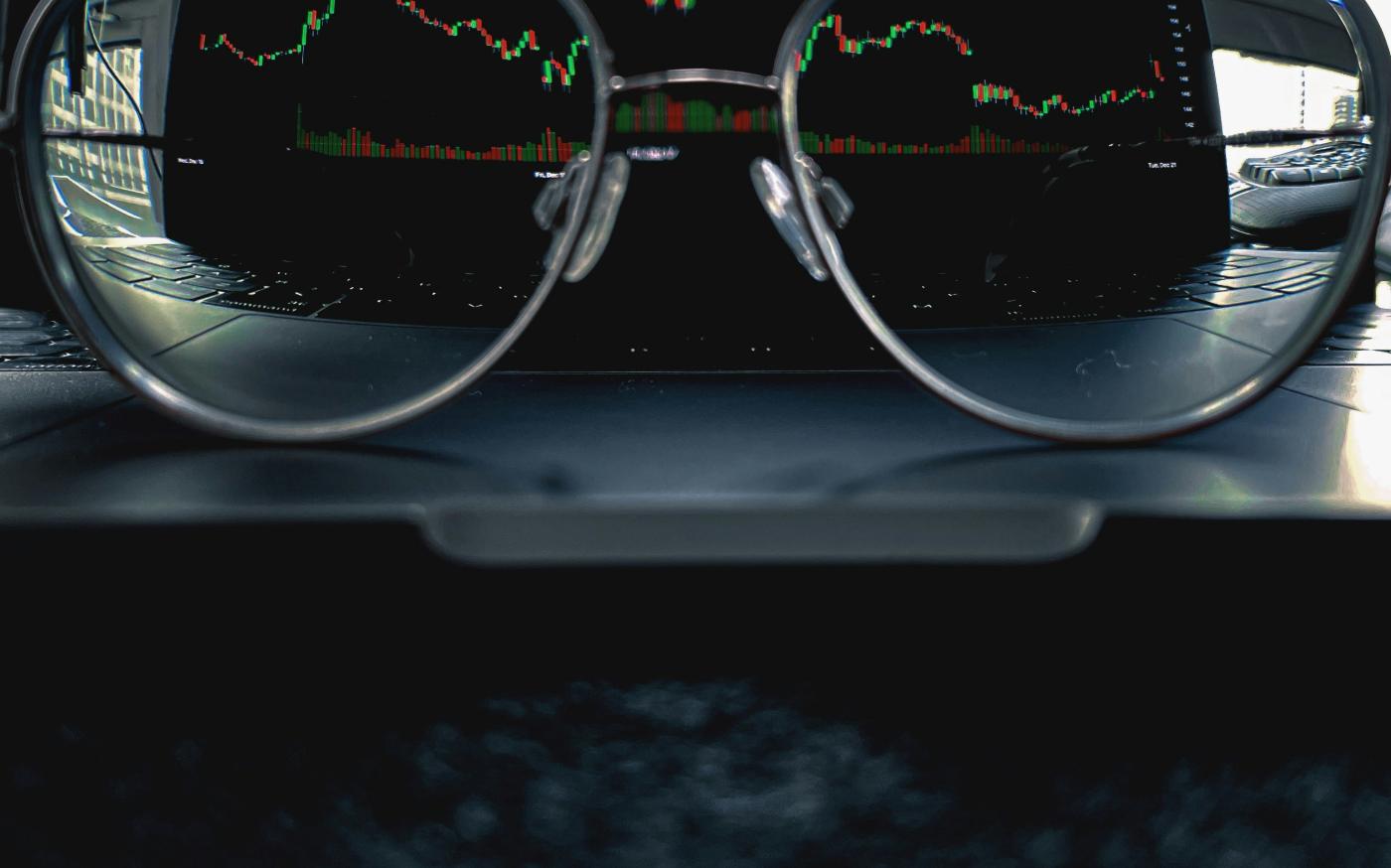 a pair of glasses sitting on top of a laptop computer by Nimisha Mekala courtesy of Unsplash.