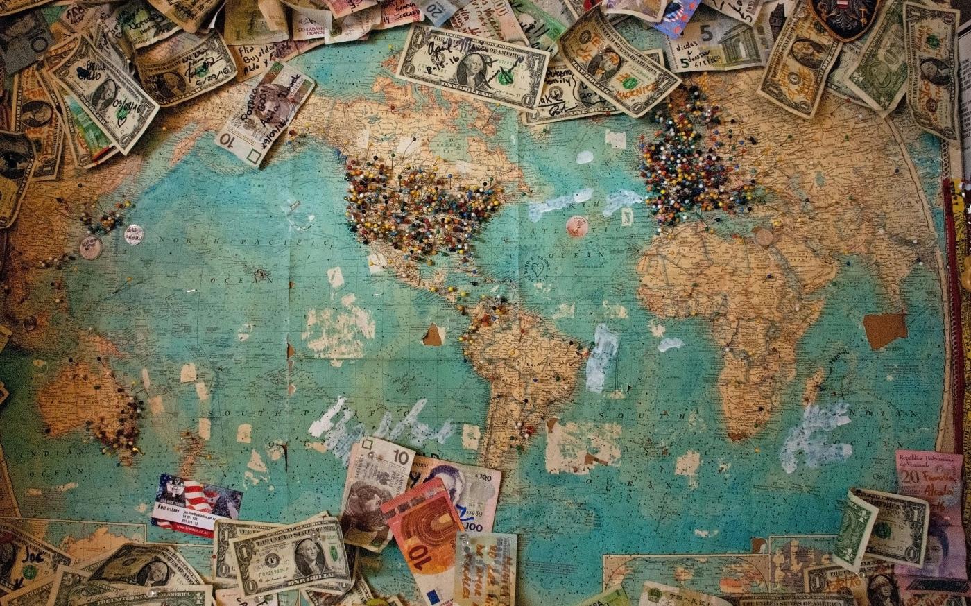 U.S. dollar banknote with map by Christine Roy courtesy of Unsplash.