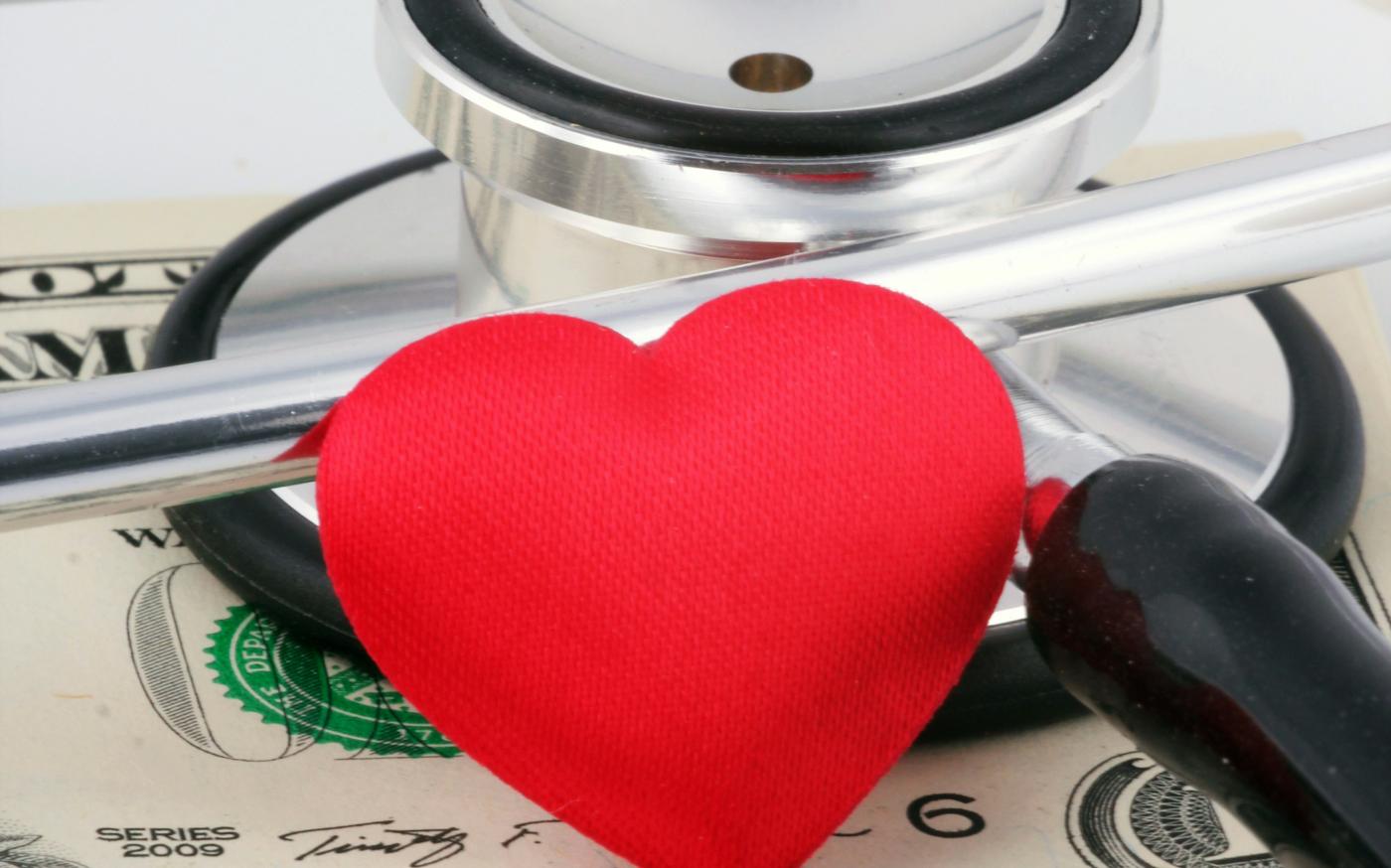 a stethoscope and a heart on top of money by Marek Studzinski courtesy of Unsplash.