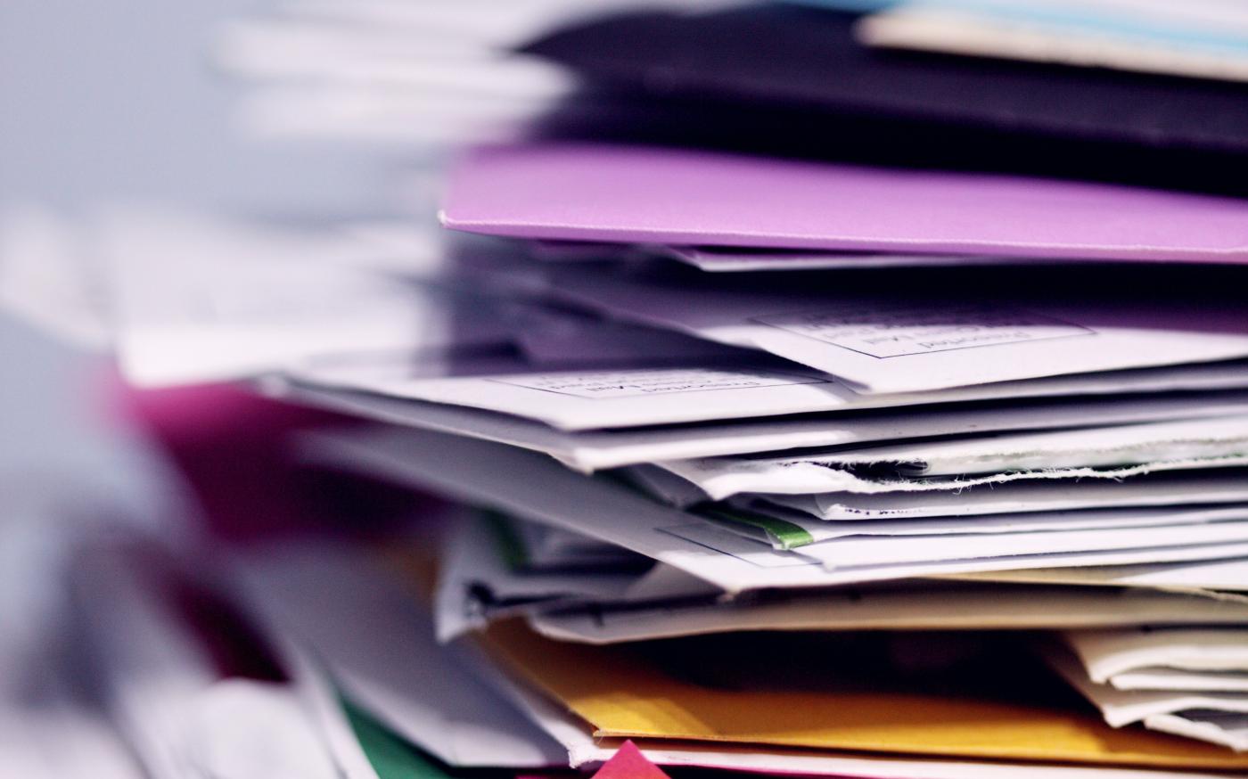 pile of printing papers by Alexander Grey courtesy of Unsplash.