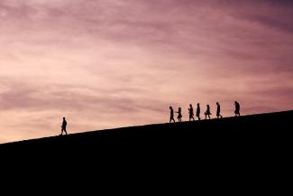 silhouette of people on hill by Jehyun Sung courtesy of Unsplash.
