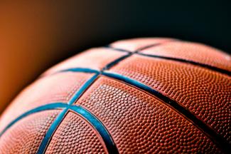 brown and black basketball ball by Kylie Osullivan courtesy of Unsplash.