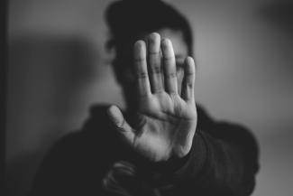 close-up photography of person lifting hands by Nadine E courtesy of Unsplash.