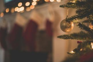 closeup photo of baubles on christmas tree by Chad Madden courtesy of Unsplash.