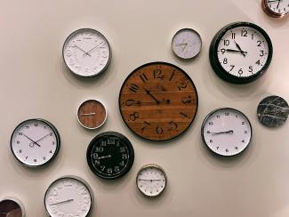 white and brown analog wall clock at 10 00 by Jon Tyson courtesy of Unsplash.