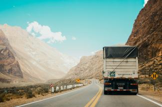 white and black truck near mountain at daytime by Rodrigo Abreu courtesy of Unsplash.